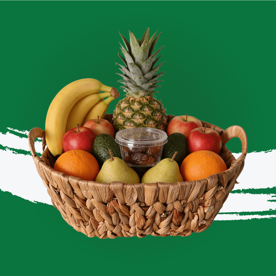 Energy Basket with assorted fresh fruits including bananas, apples, pears, oranges, and pineapple.
